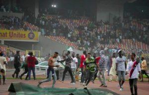 Nigerian fans encroaching the pitch after the Qatar 2022 World Cup qualifier match between Nigeria and Ghana at the Moshood Abiola Stadium in Abuja